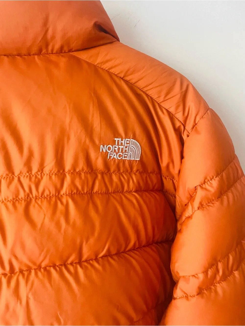 The North Face 550 Orange Rust Puffer Jacket